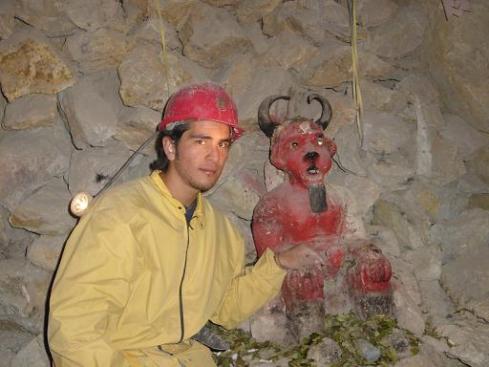 A Peruvian Miner with A Supay Votive Statue