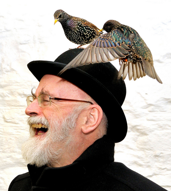 Terry Pratchett with Starlings on his Head